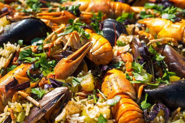 Premium Photo | Spanish seafood paella with prawns mussels and crayfish