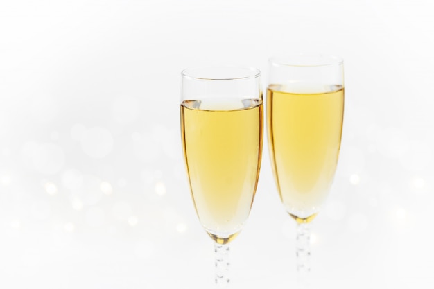 Sparkling new year background with champagne and stars. christmas and happy new year concept. Premium Photo