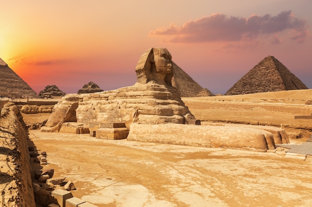 Premium Photo | The sphinx and the pyramids, beautiful close sunset ...