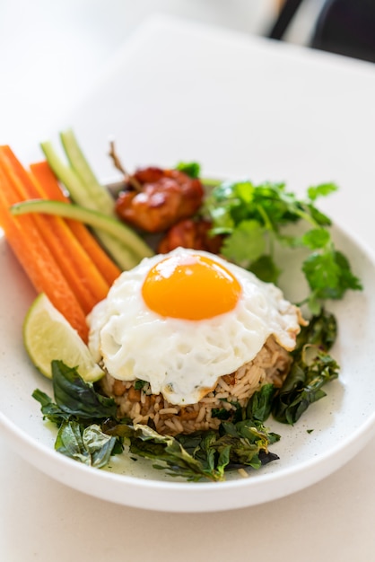 Premium Photo | Spicy fried rice with fried egg and vegetable