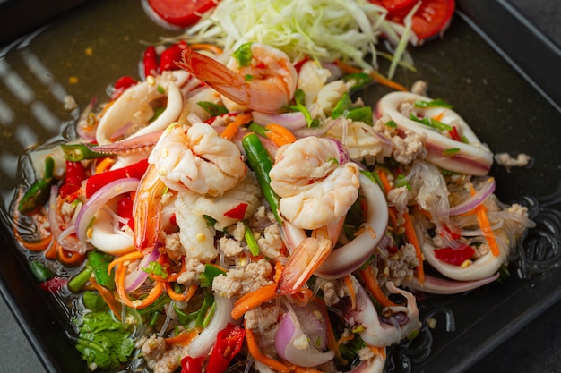 Free Photo | Spicy mixed seafood salad with thai food ingredients.