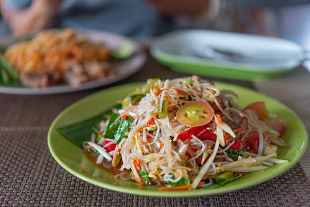 Premium Photo | Spicy papaya salad with rice vermicelli