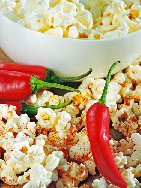 Premium Photo | Spicy popcorn with chili pepper