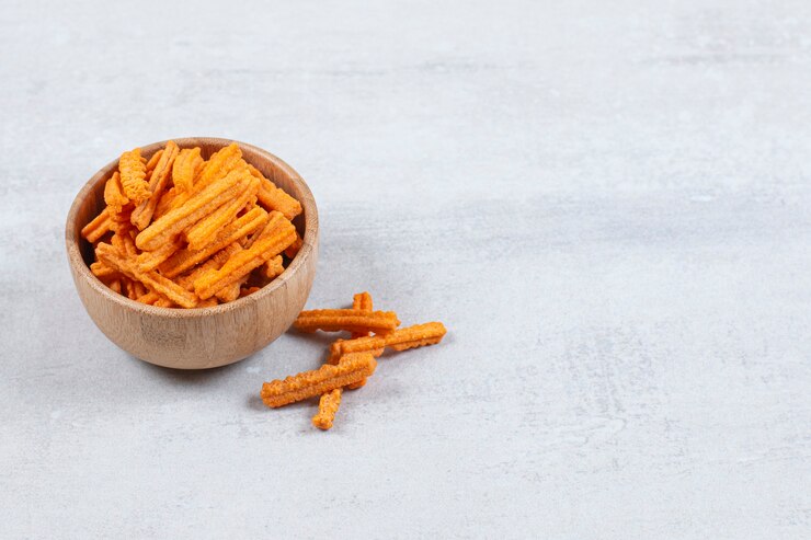 Free Photo | Spicy stick chips in wooden bowl.