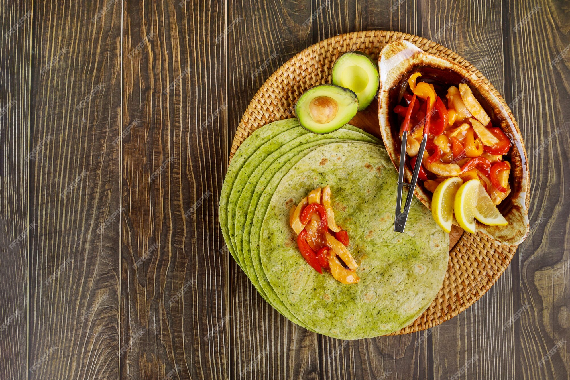 premium-photo-spinach-wrap-with-stir-fry-beef-and-vegetable-on-wood-table