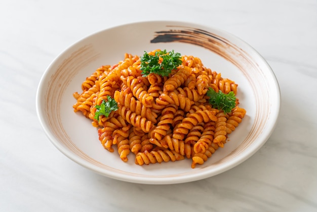 Premium Photo Spiral Or Spirali Pasta With Tomato Sauce And Parsley