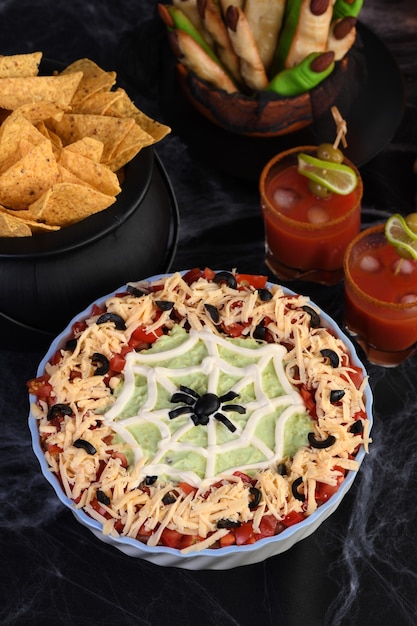 Premium Photo | Spooky Halloween Seven Layer Taco Dip Turn Appetizer ...