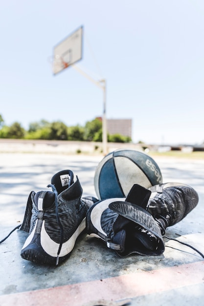 Free Photo | Sport shoes and basketball on outdoors court