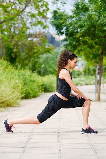 Free Photo | Sportswoman stretching and preparing to run