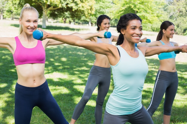 Premium Photo | Sporty women lifting hands weights