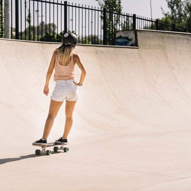 Free Photo | Sporty young girl with helmet skating