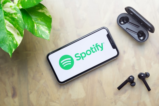 Download Free Spotify Logo Display On Iphone With Bluetooth Headphones Premium Use our free logo maker to create a logo and build your brand. Put your logo on business cards, promotional products, or your website for brand visibility.
