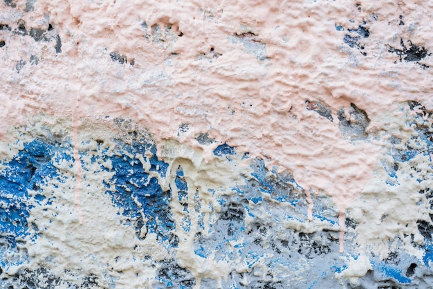 壁のテクスチャの壁紙に白と青のペンキの斑点 プレミアム写真