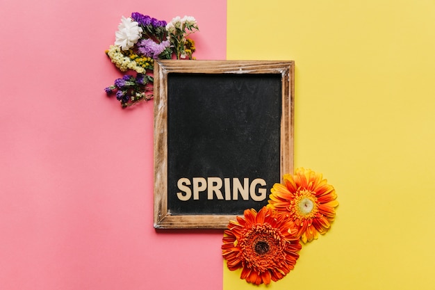 Free Photo | Spring blackboard and colorful flowers