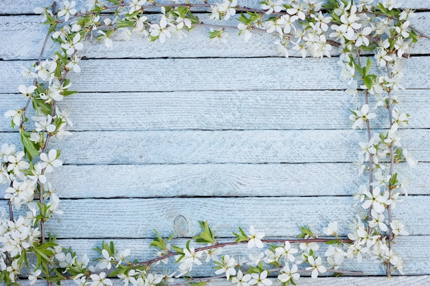 Premium Photo | Spring flowers on wooden table background.