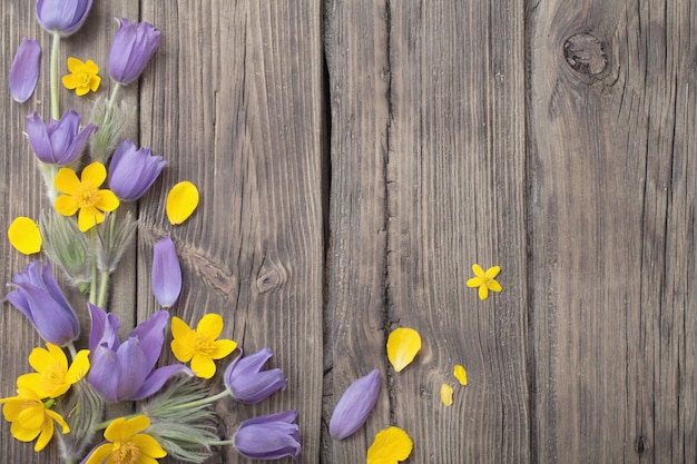 Premium Photo Spring Purple And Yellow Flowers On Old Wooden Background