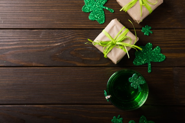 St. patrick's day green beer pint, decorated with shamrock leaves. patrick day pub party, celebrating. Premium Photo