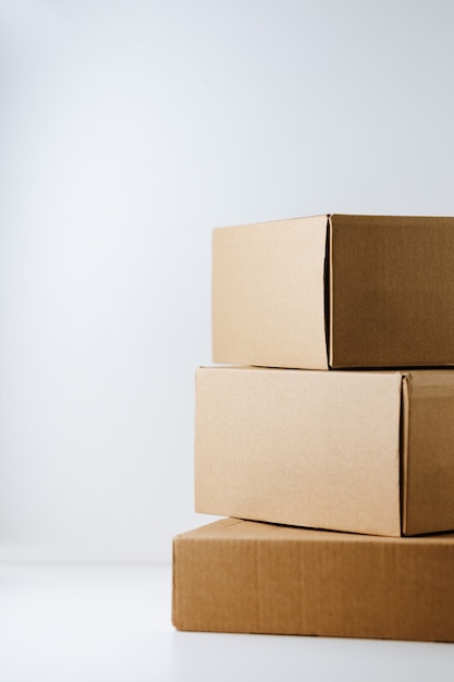 Premium Photo Stack Of Cardboard Boxes On White Background