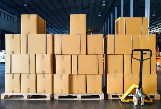 Premium Photo Stack Of Cardboard Boxes On Wooden Pallet Cargo