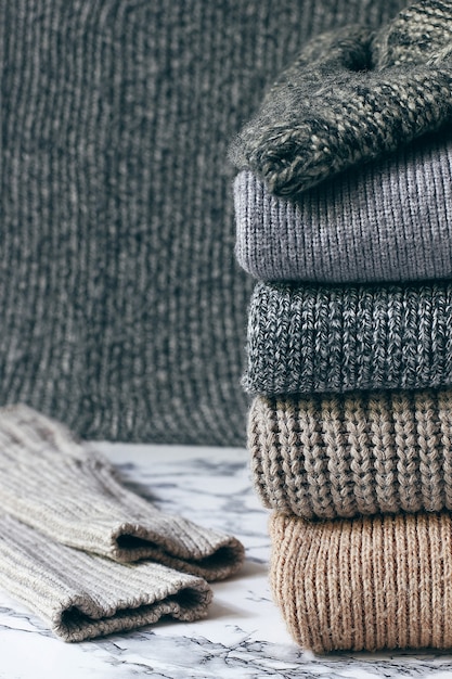 Free Photo | Stack of cozy knitted sweaters. autumn-winter concept ...