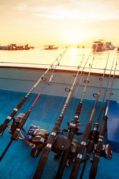 Premium Photo | Stack of fishing rod on fishing boat