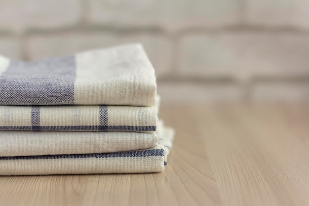 Premium Photo | A stack of folded kitchen towels lies on the surface.