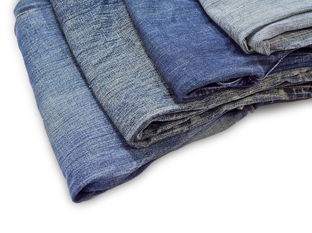 Premium Photo | Stack of jeans isolated on white