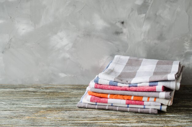 Premium Photo Stack Of Kitchen Towels Or Napkins Over The Rustic Wooden Table