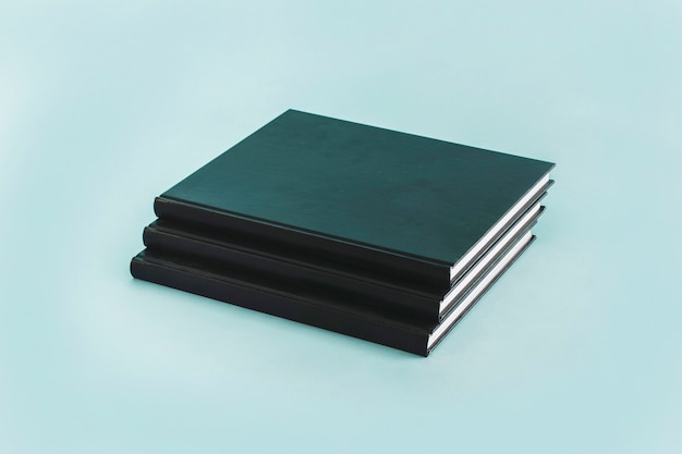 Stack of black notebooks  Photo | Free Download