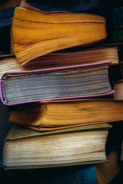 Premium Photo | A stack of old paper books. faded paper pages.