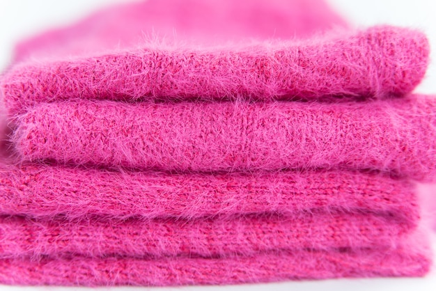 Premium Photo | Stack of pink folded clothes