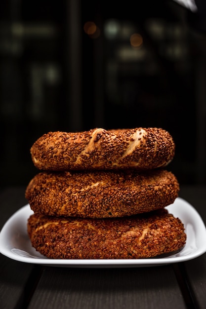 Premium Photo | A stack of turkish simit with sesame seeds