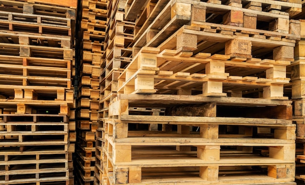 Premium Photo | Stack of wooden pallet industrial wood pallet at ...