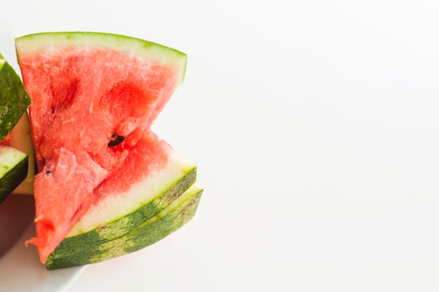 Stacked of juicy watermelon triangular slices isolated on white background Free Photo