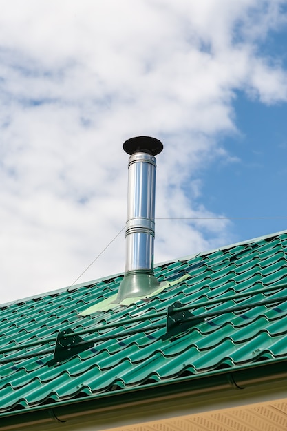 Premium Photo | Stainless steel metal chimney pipe on the roof of the ...