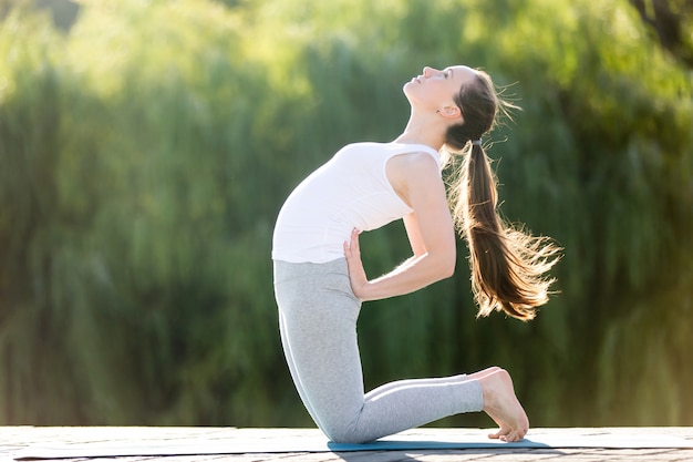 Free Photo | Standing in camel pose