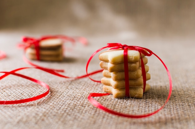 Free Photo | Star cookies with ribbon on table