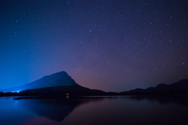 Premium Photo | Starry sky over a lake