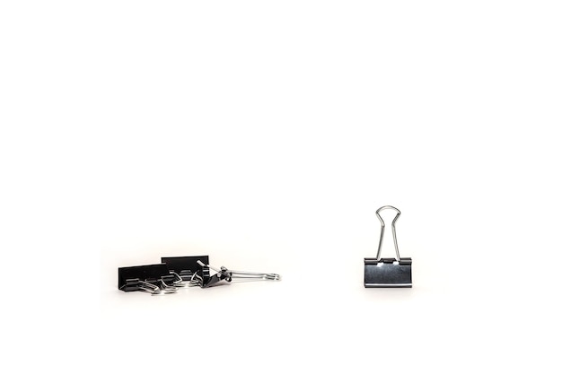 snijder martelen ondergronds Premium Photo | Stationery metal paper clip isolated. office folding clips  scattered on desk. close-up of tool for clamping papers documents