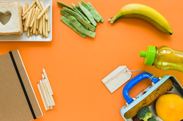Free Photo | Stationery near lunch food