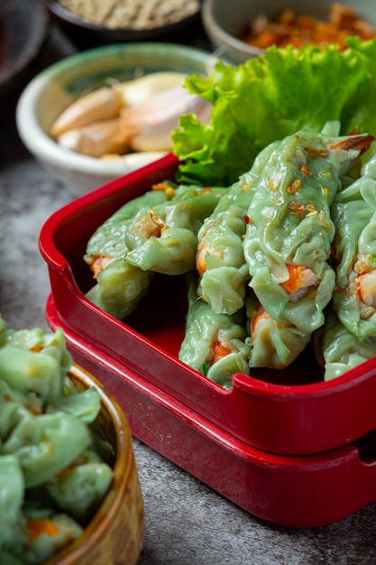 Free Photo | Steamed shrimp wontons dim sum with raw materials.