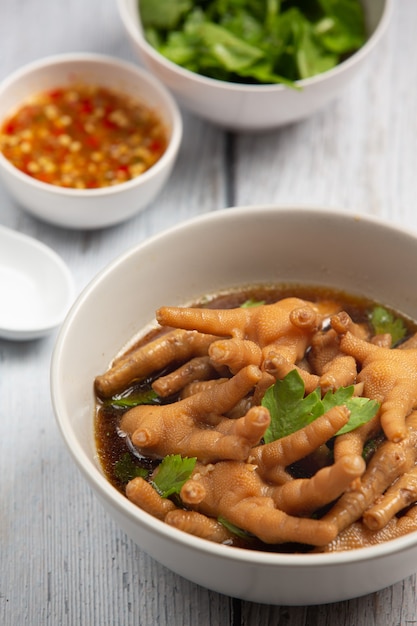 Free Photo | Stewed chicken feet soup served with spicy fish sauce