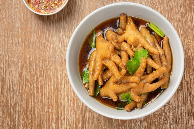 Free Photo | Stewed chicken feet soup served with spicy fish sauce