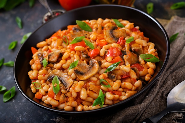 Premium Photo Stewed White Beans With Mushrooms And Tomatoes With