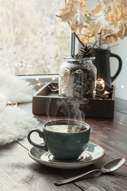 still-life-in-home-interior-cozy-autumn-or-winter-cozy-winter-or-autumn-cup-of-coffee-at-home-warm-fluffy-furskin-garland-swedish-hygge-concept_91908-1750.jpg
