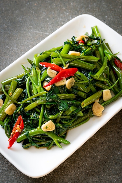 Premium Photo | Stir-fried chinese morning glory or water spinach