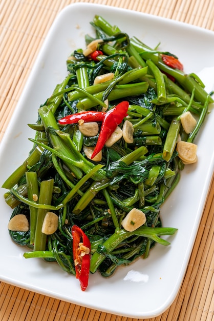 Premium Photo | Stir-fried chinese morning glory or water spinach