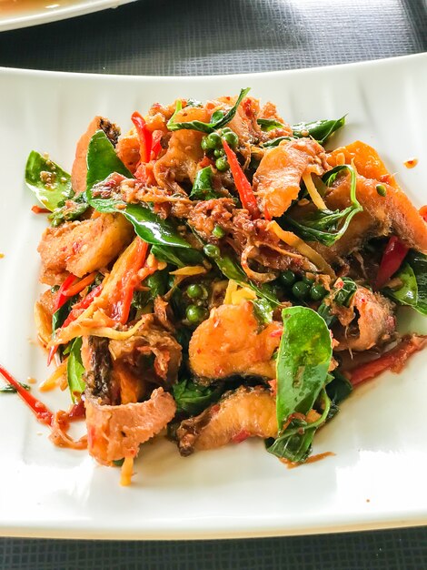 Premium Photo | Stir fried fish with spicy herb