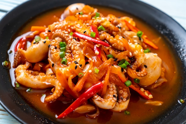 Premium Photo | Stir-fried octopus or squid with korean spicy paste ...