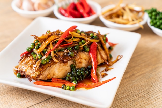 Premium Photo | Stir-fried spicy and herb with grouper fish fillet